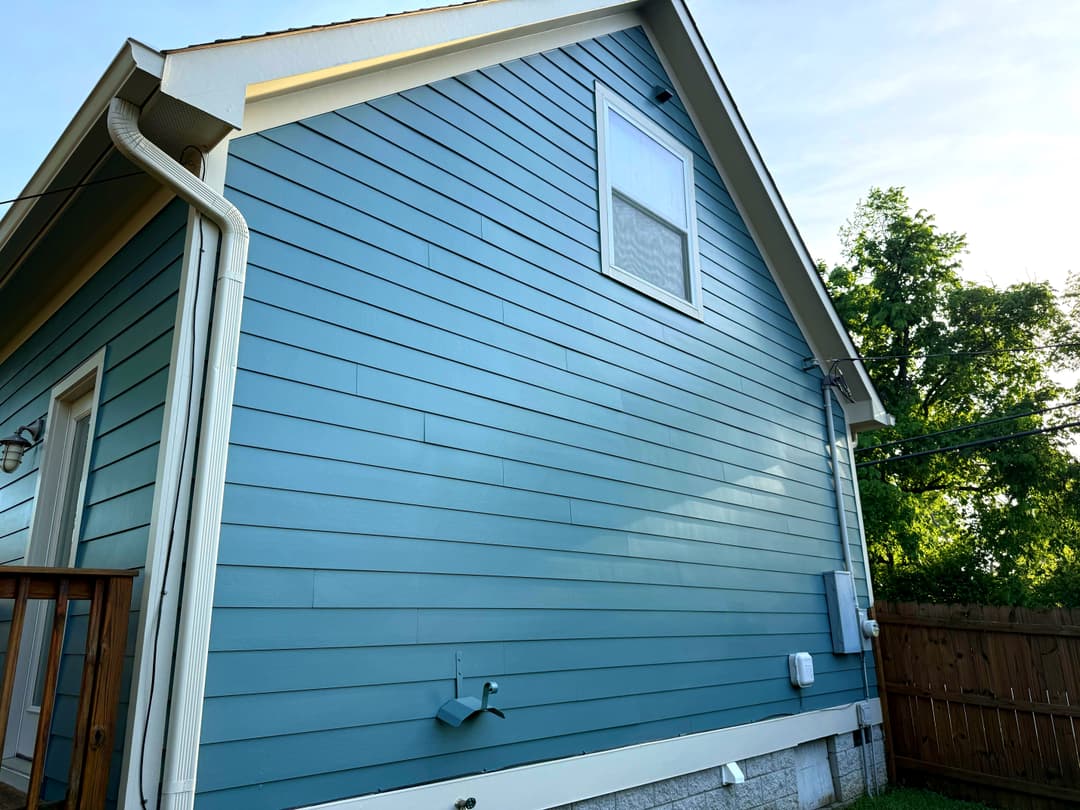 Blue lap siding exterior repaint with white trim in The Nations, Nashville