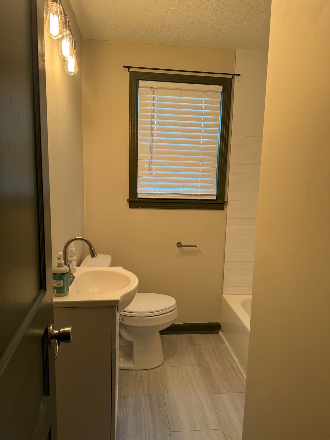 Bathroom with dark-painted window trim and door, McGinnis Dr, Inglewood